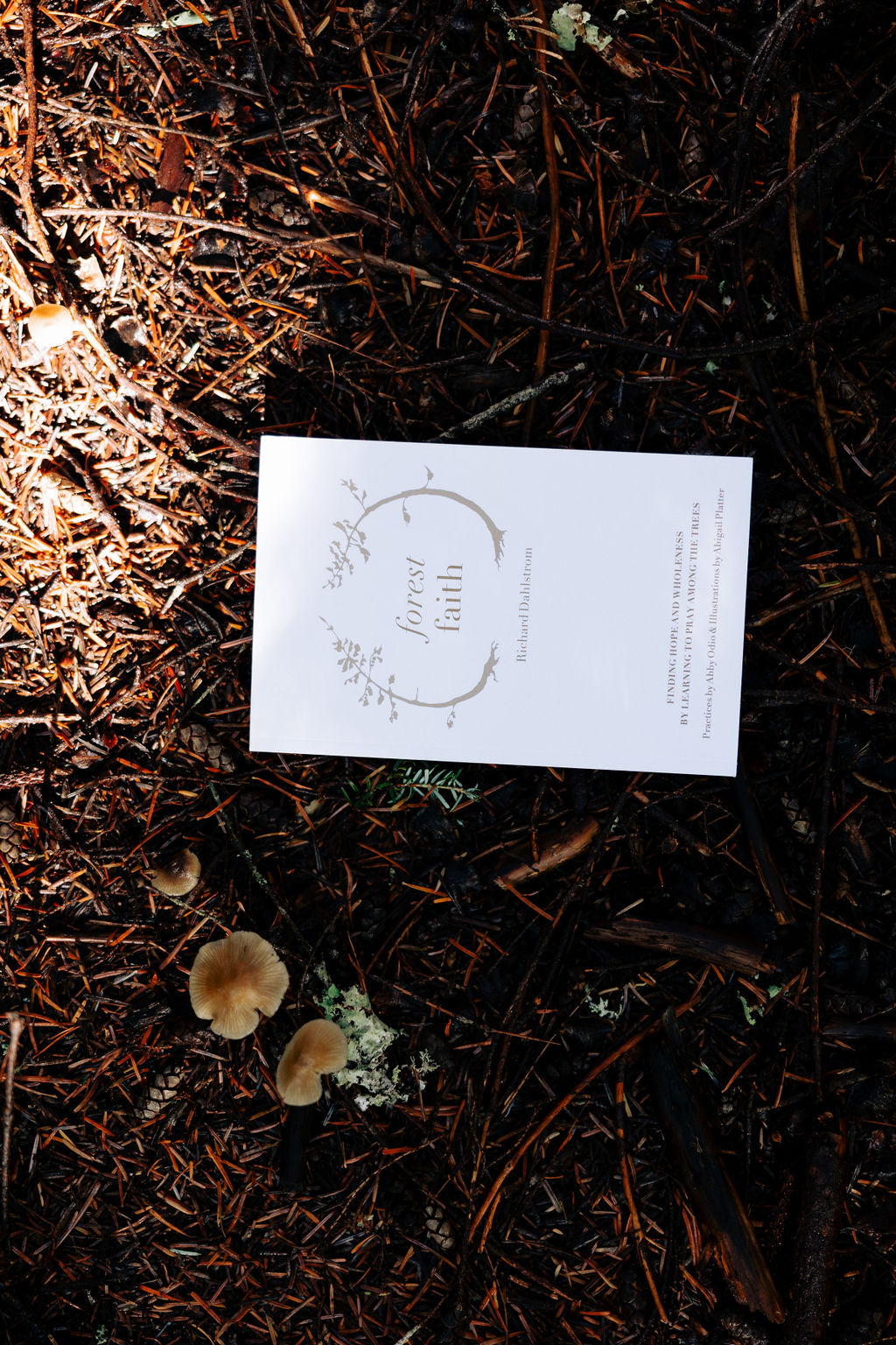 Forest Faith booklet by Richard Dahlstrom on the forest floor